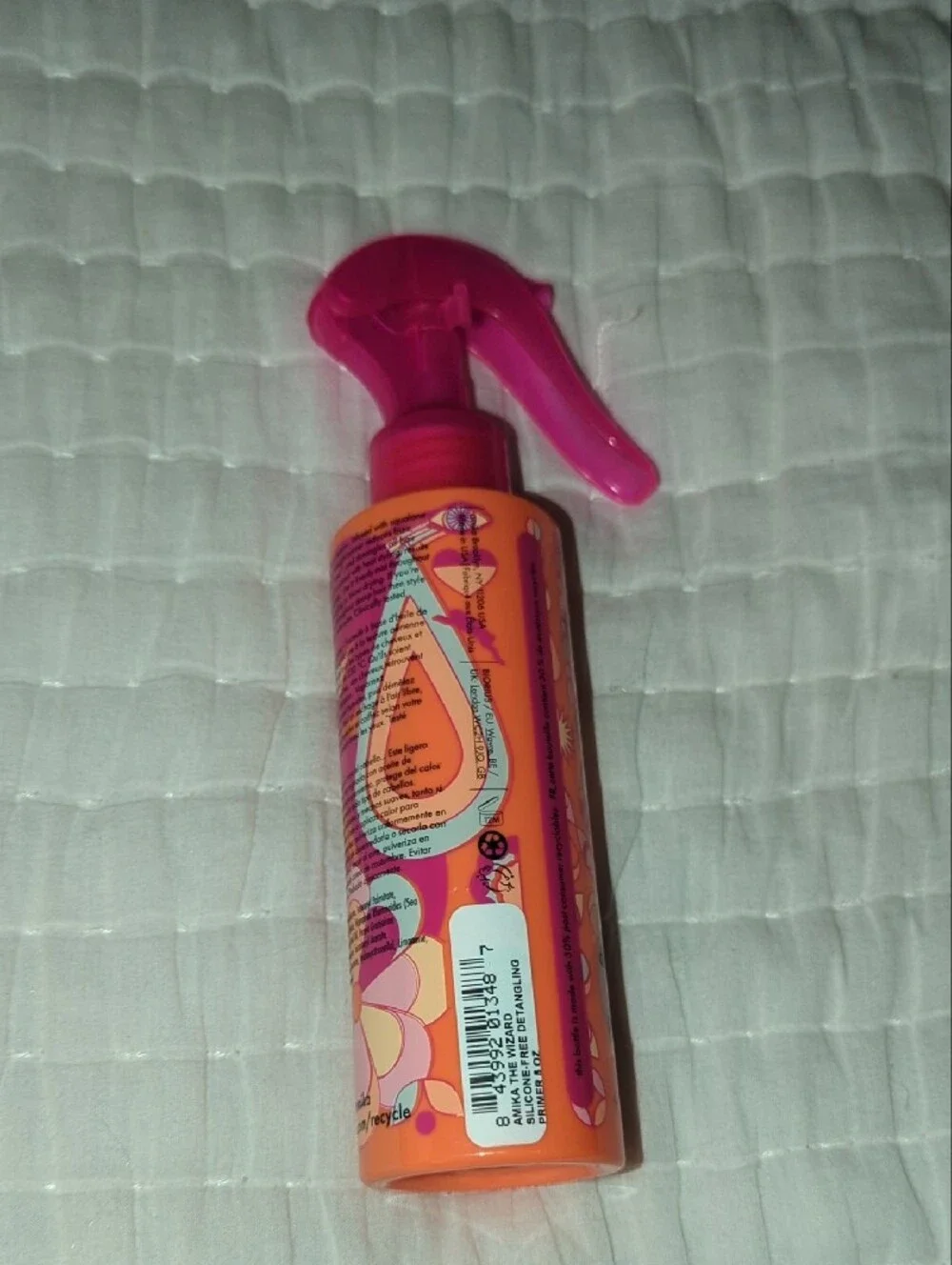 amika Detangling Primer in Pink and Orange